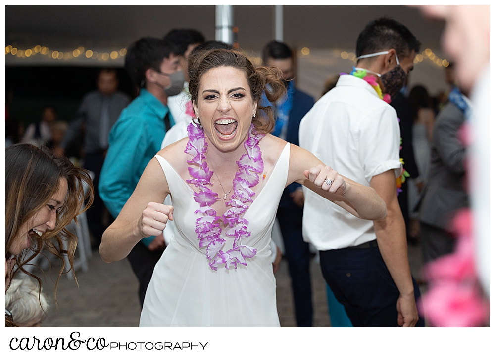 a bride dancing and singing during her joyful Pineland farms wedding reception