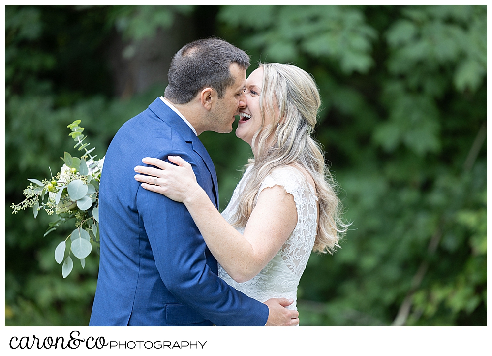 a bride and groom kiss during their Kingsley pines maine wedding day first look