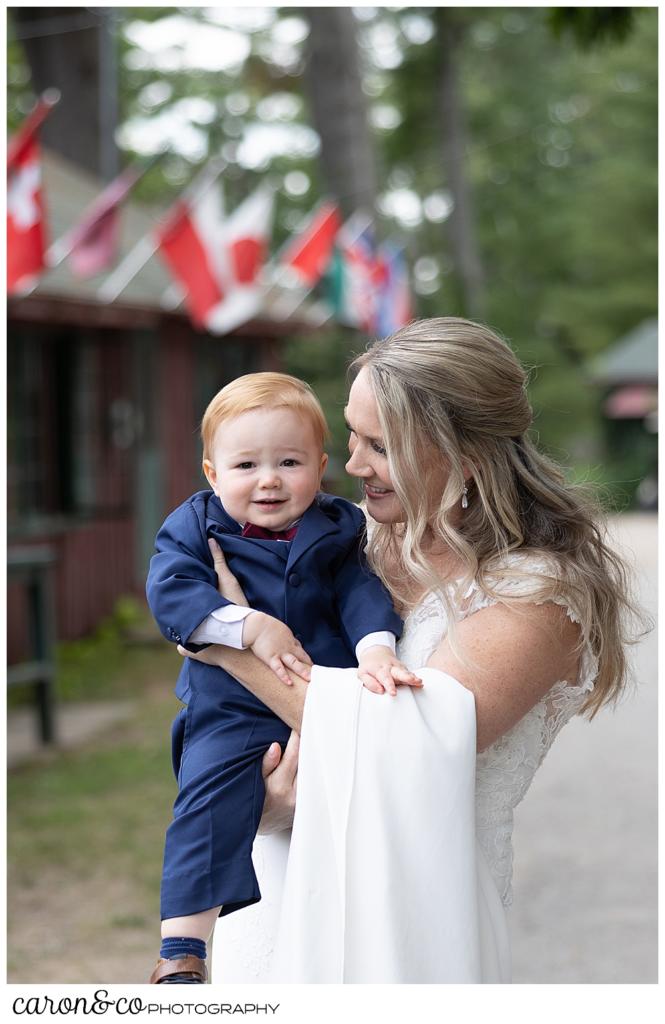 a bride cuddles her young son during her Kingsley Pines wedding
