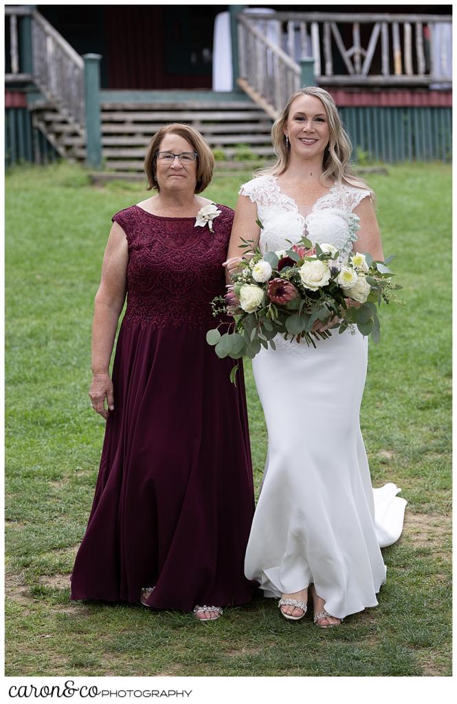 a bride and her mother walk down the aisle at a Kingsley Pines maine wedding ceremony