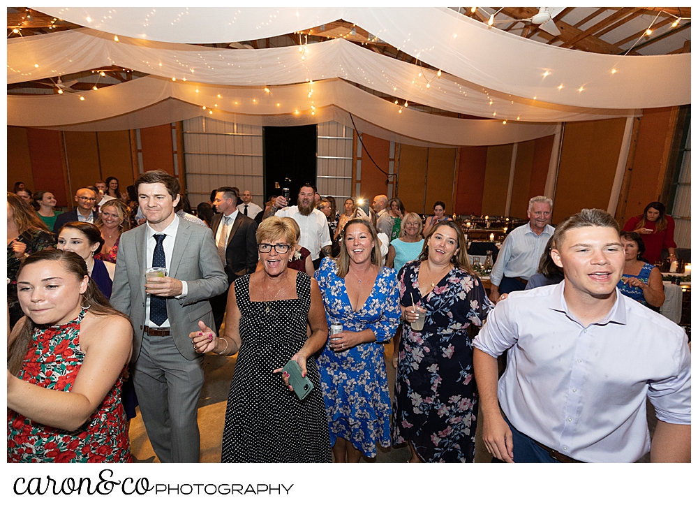 wedding guests dancing at a Kingsley Pines Maine wedding reception