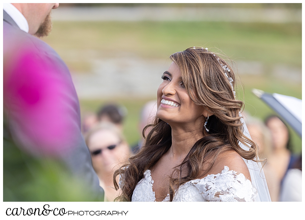 a bride smiles up at her groom during their wedding at Maine Wedding Barn Minot Maine