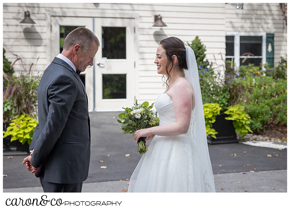 a bride and her father having a first look at the Spruce Point Inn, Boothbay Harbor, Maine