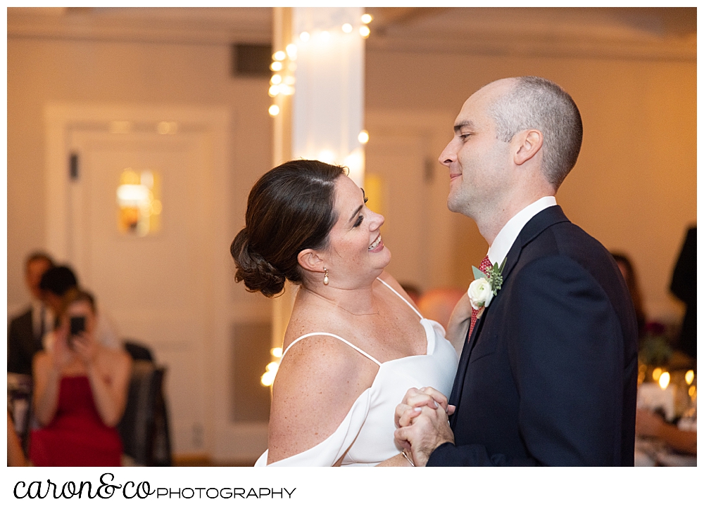 bride and groom dancing their first dance in the ballroom at a Nonantum Resort Kennebunkport Maine wedding reception