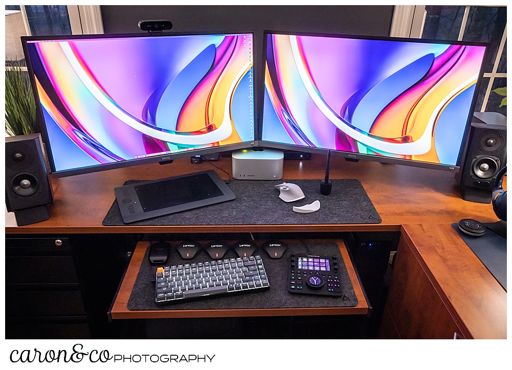 Mac Studio M1 Ultra workstation for Maine wedding photographers caron&co photography. Also pictured, two color monitors, Wacom Tablet, a Loupe deck CT, 4 Lexar 3-in-1 card readers, Logitech MX3 mouse, and 2 Deltahub desk pads