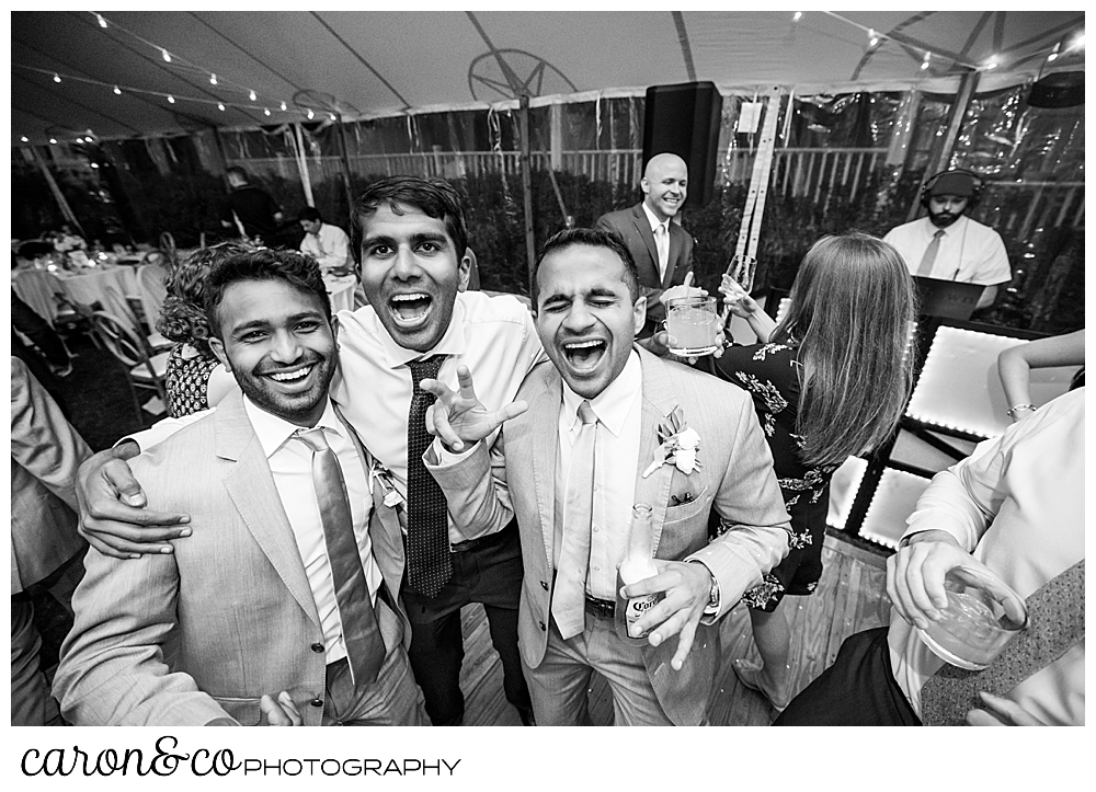 black and white photo of a group of men on the dance floor at a tented breakwater inn Kennebunkport wedding reception