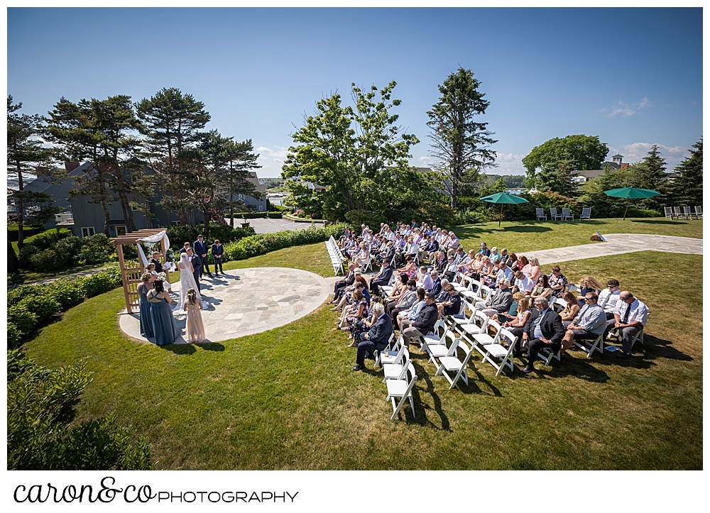 a side view of an outdoor Kennebunkport Maine colony hotel wedding ceremony