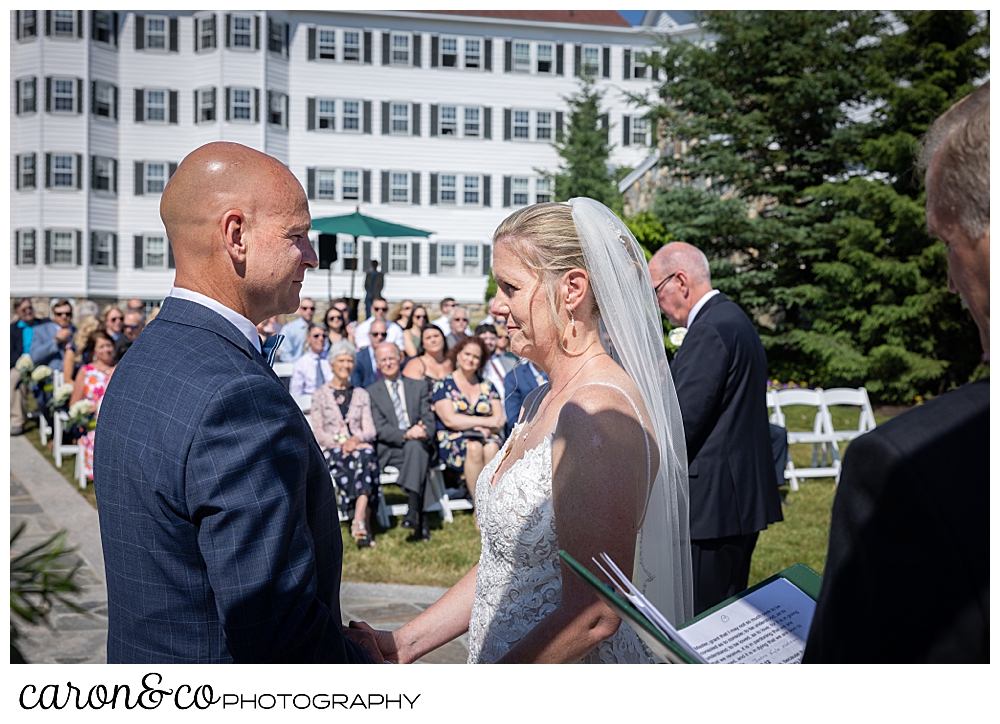 a bride and groom standing together at their Kennebunkport Maine colony hotel wedding ceremony