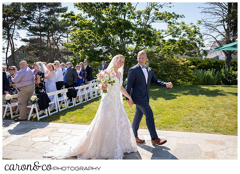 a bride and groom during their recessional at a Kennebunkport Maine colony hotel wedding ceremony