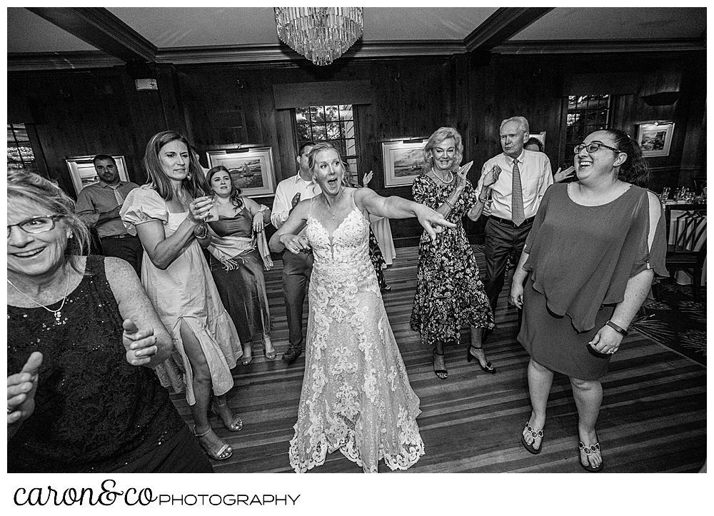 black and white photo of a bride dancing among her guests at a colony hotel Kennebunkport Maine wedding reception