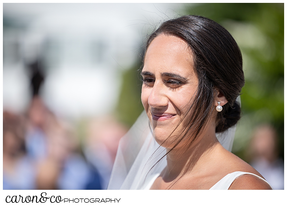 a bride smiles during her Kennebunkport Maine wedding at the colony hotel