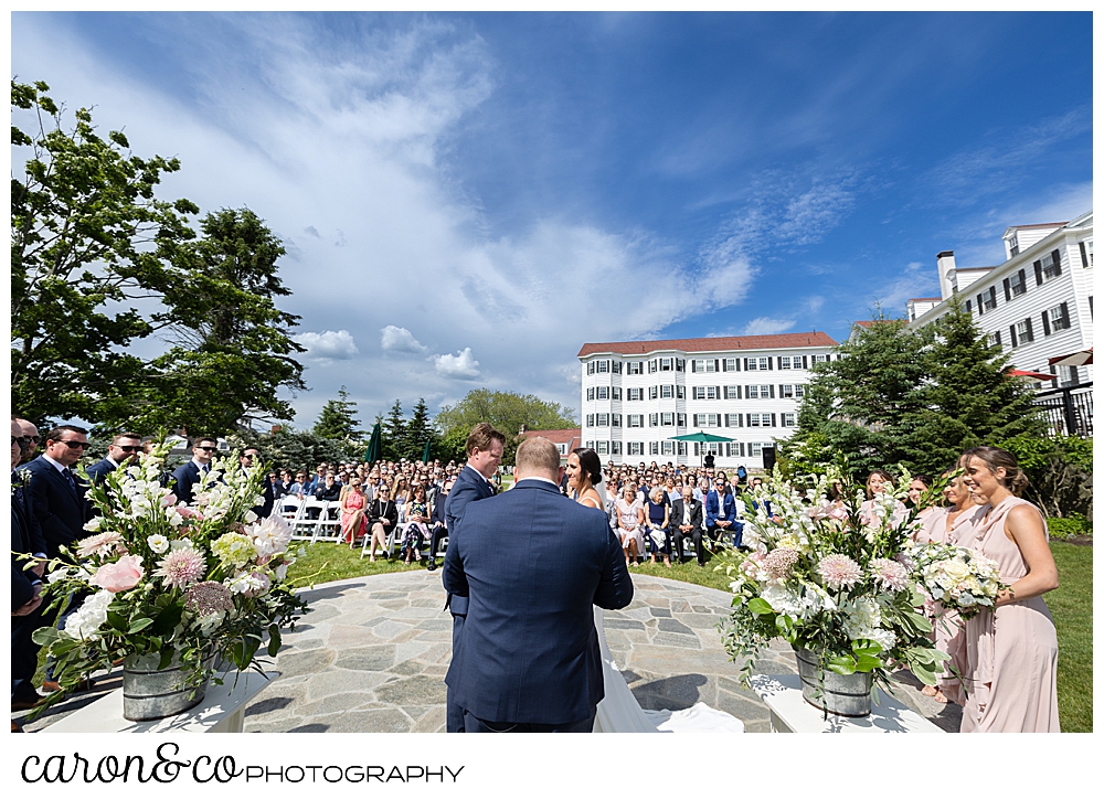 a view of an outdoor ceremony at a Kennebunkport Maine wedding at the Colony Hotel
