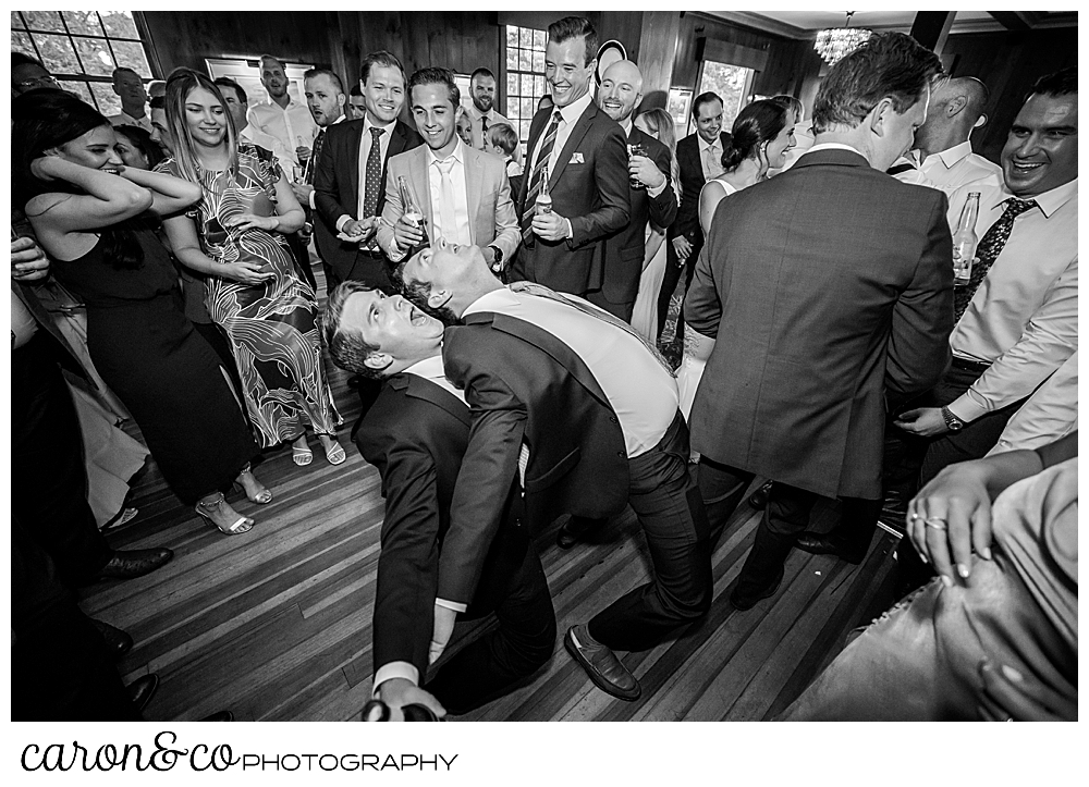 black and white photo of people having fun on the dance floor