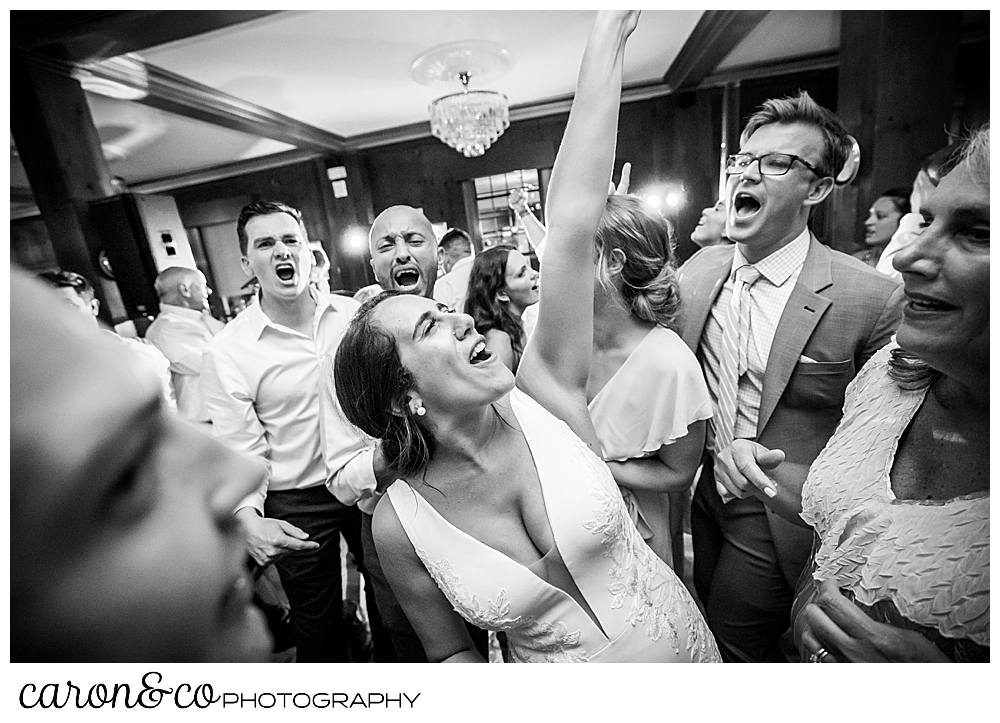 a bride is having the time of her life singing and dancing during her colony hotel Kennebunkport Maine wedding reception