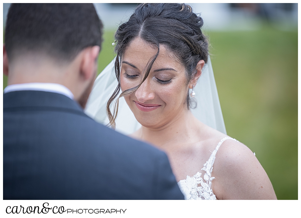 a bride smiles during her wedding day first look at a spring wedding at the colony hotel Kennebunkport Maine