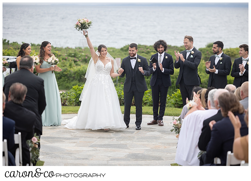 a smiling bride and groom as they begin the recessional at their colony hotel Kennebunkport maine wedding ceremony
