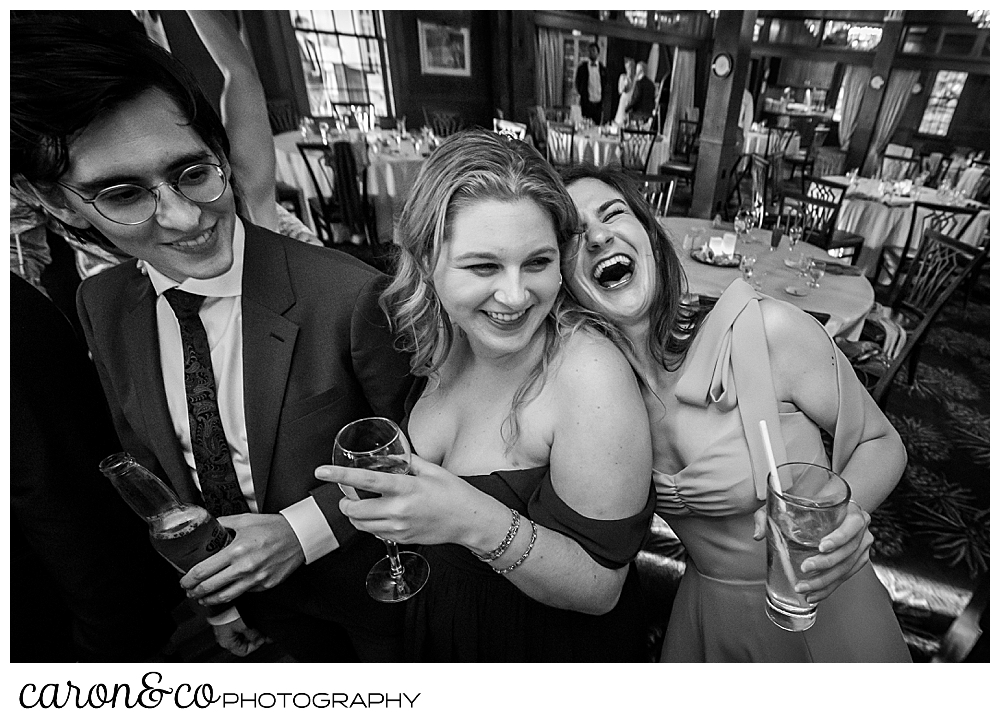 black and white photo of wedding guests laughing during a colony hotel wedding reception, Kennebunkport maine