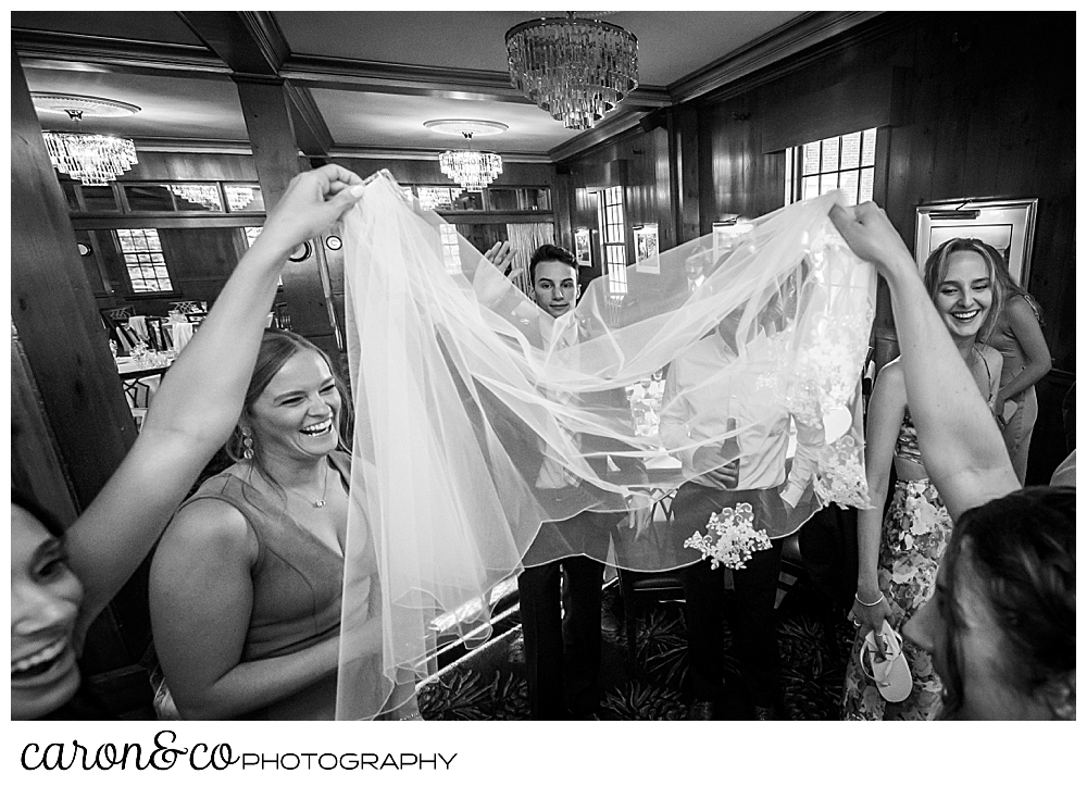 black and white photo of the bride's veil which has come out during the dance party