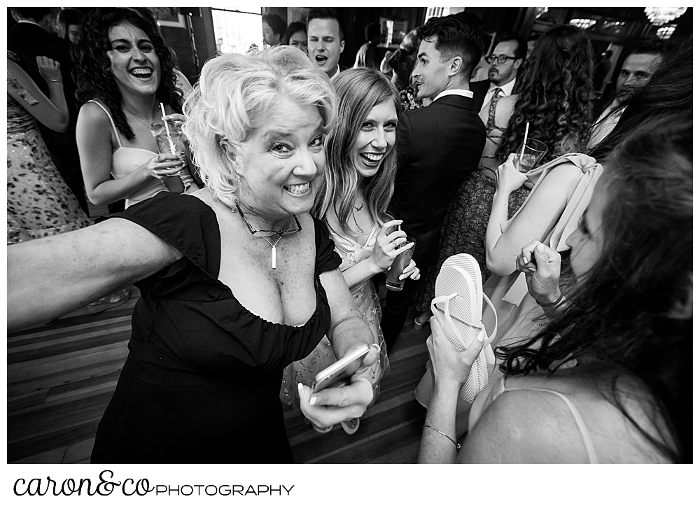 black and white photo of women having a good time on the dance floor