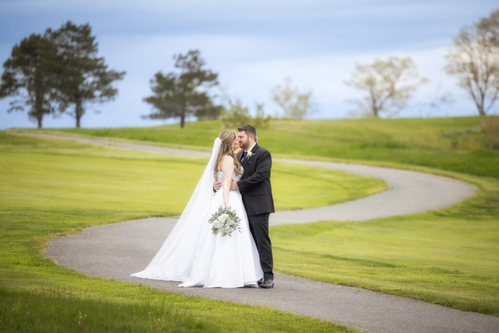 couple on wedding day on curving path